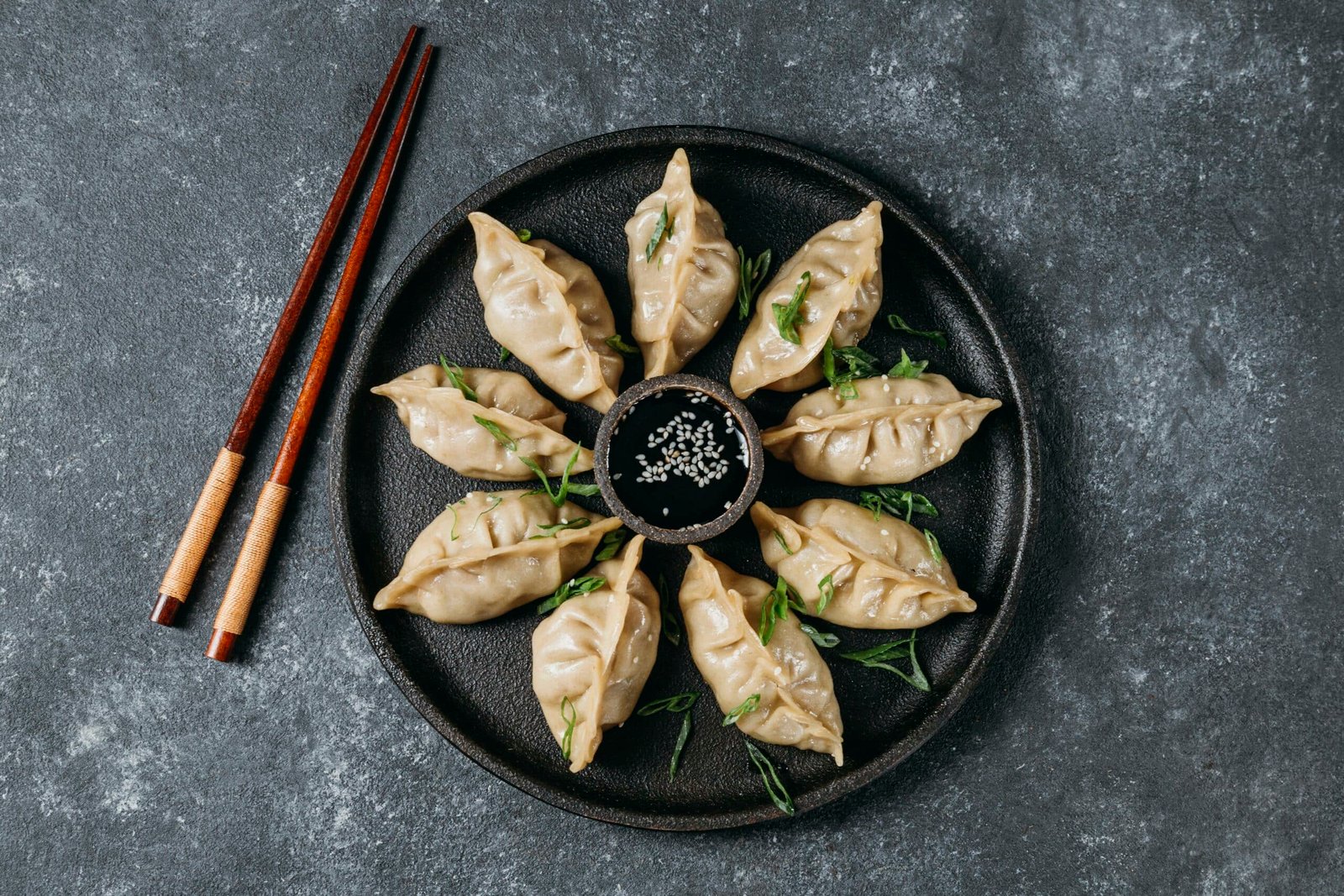 Konjac Chinese dumplings on a plate with two chopsticks