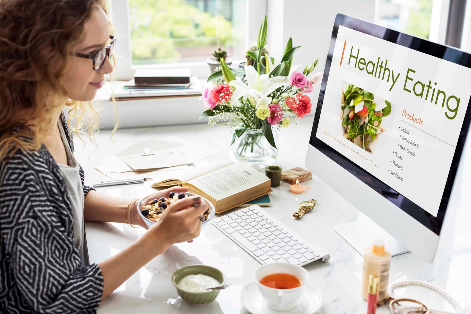 a women looking at a screen trying to plan a healthy diet plan