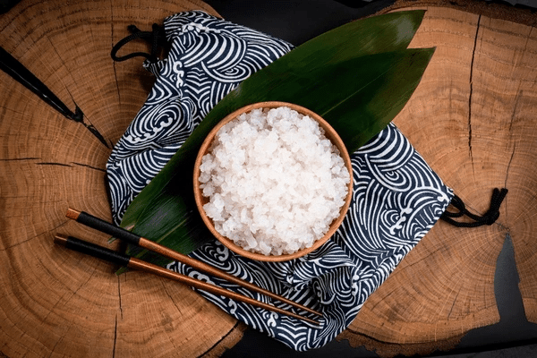 A bowl of konjac rice keto food - a low-carb, low-calorie alternative to traditional rice, ready to be enjoyed with chopsticks.