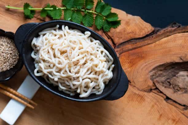 Low FODMAP snacks option with konjac noodles on a black ceramic cup